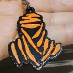 Portachiavi Dakar in gomma siliconica auto MOTO Nero E Arancio